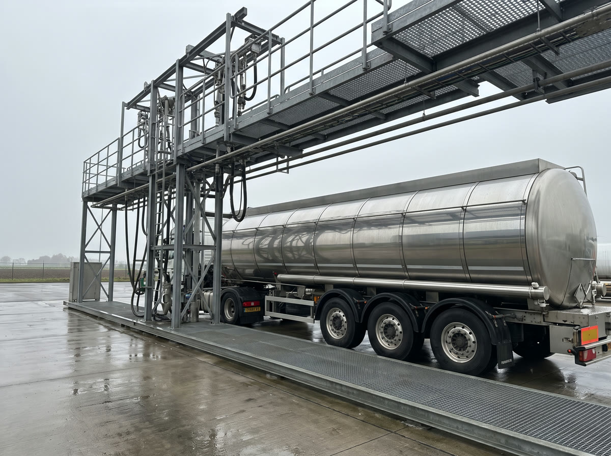 A road fuel tanker being loaded beneath a terminal gantry